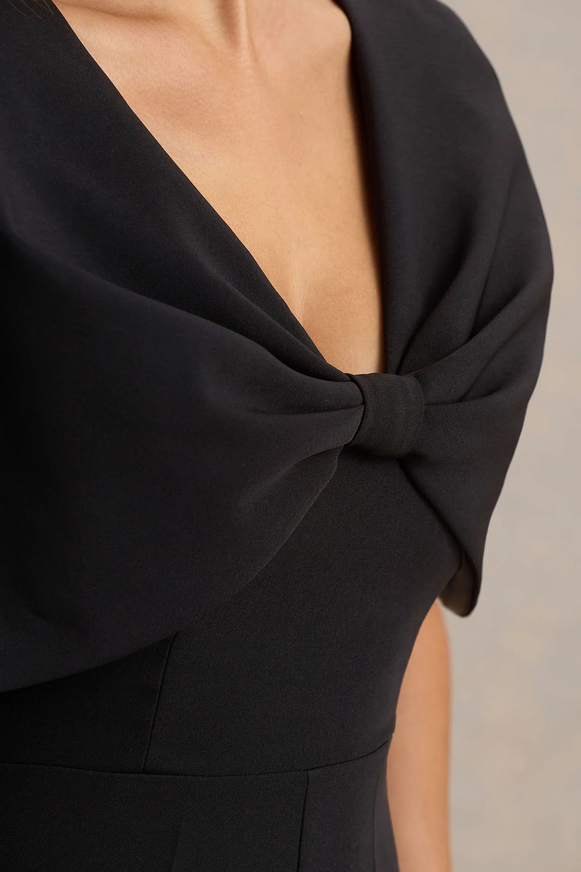 Vivid Black Plunge Neck Jumpsuit With Bow Detail