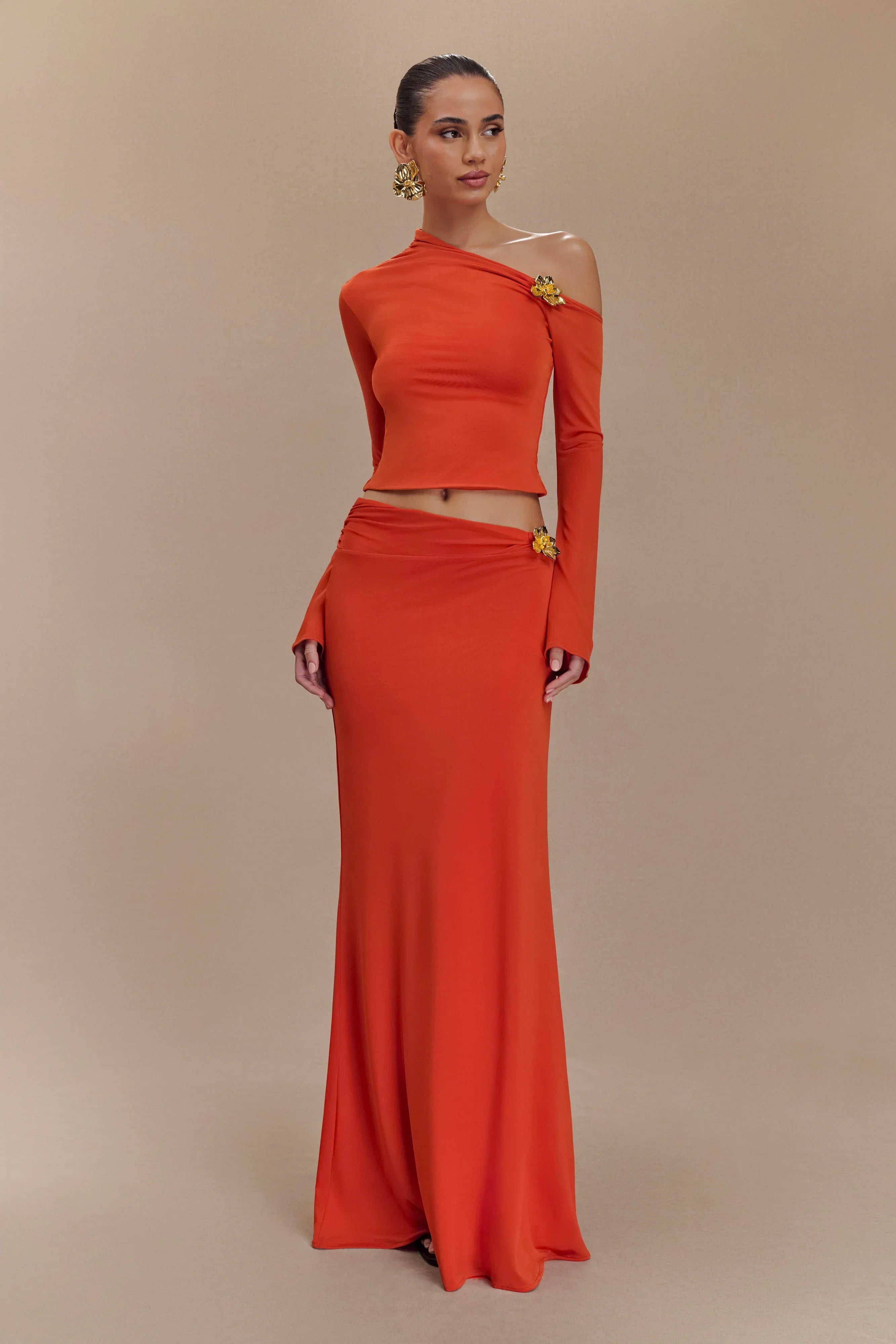 Ainsley Asymmetrical Long Sleeve Top With Floral Hardware Burnt Orange