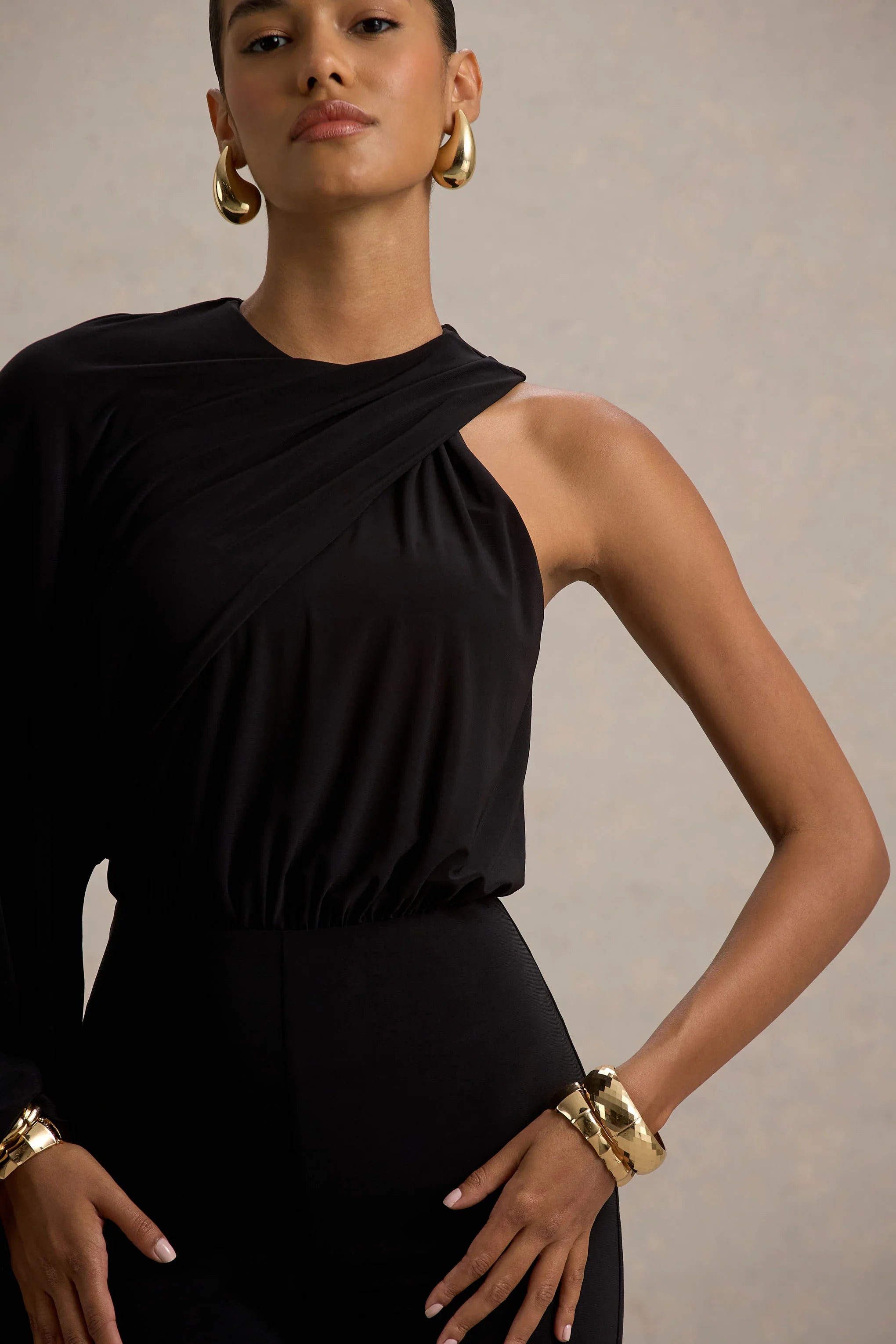 Asra Black High Neck Flared Leg Jumpsuit With Cape Sleeve