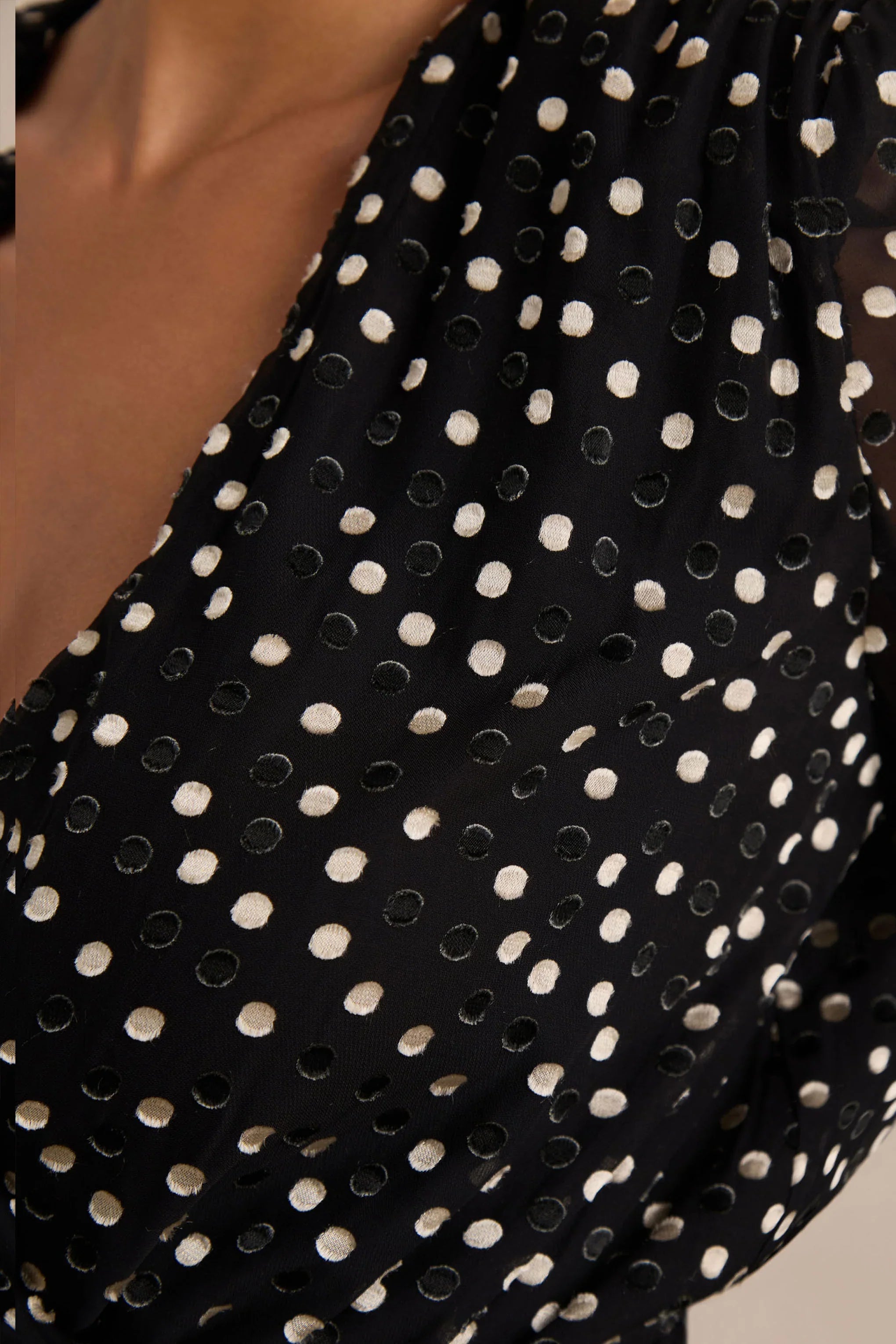 Mela Black And White Polka Dot Plunge Neck Mini Dress With Bell Sleeves And Sash Detail
