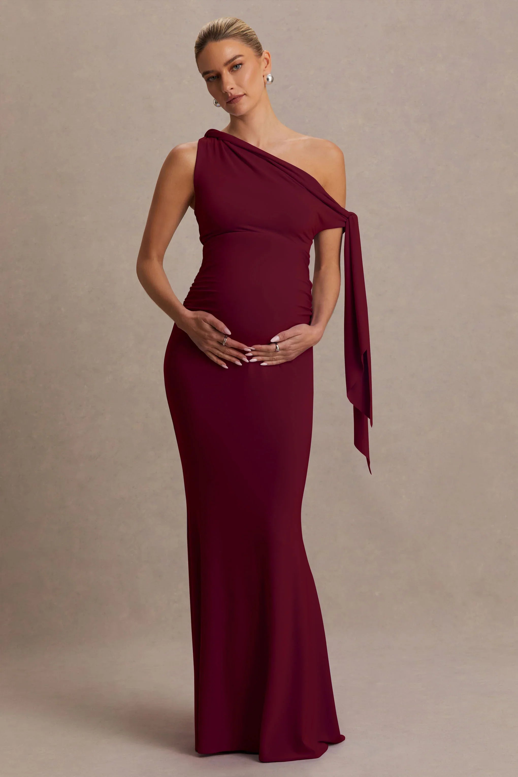 Orielle Burgundy Asymmetric Neck Maternity Maxi Dress With Knot Sleeve And Sash