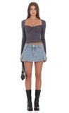 Pleated Flare Denim Mini Skort in Washed Blue