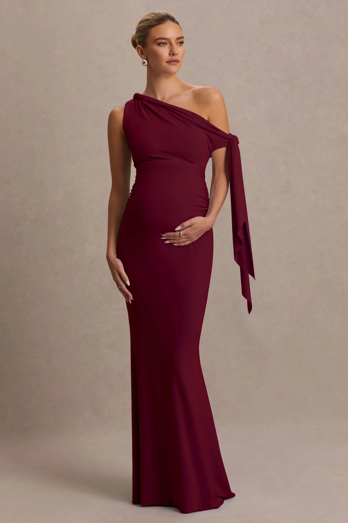 Orielle Burgundy Asymmetric Neck Maternity Maxi Dress With Knot Sleeve And Sash