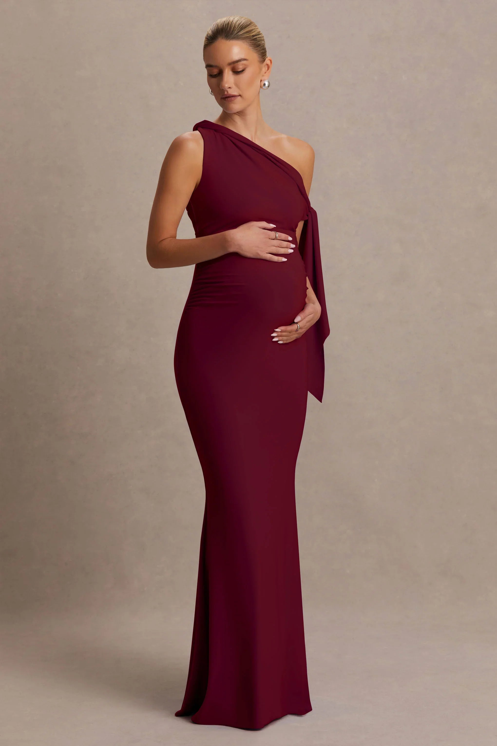 Orielle Burgundy Asymmetric Neck Maternity Maxi Dress With Knot Sleeve And Sash
